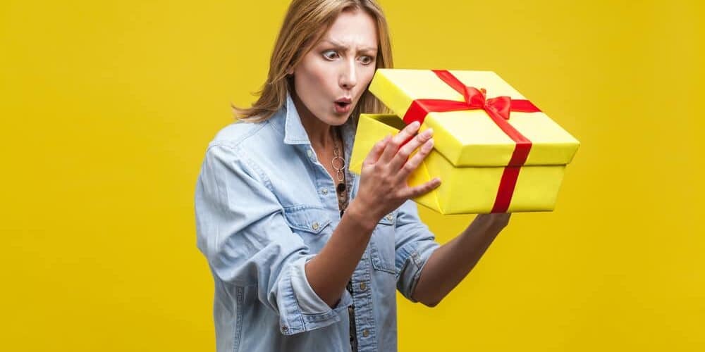 Woman looking inside a gift box