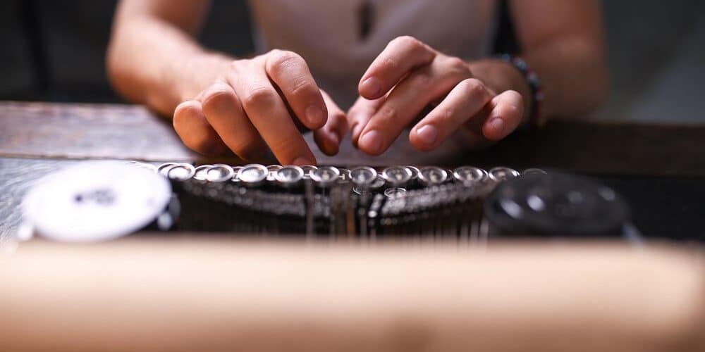 author writing back story and developing character on their typewriter