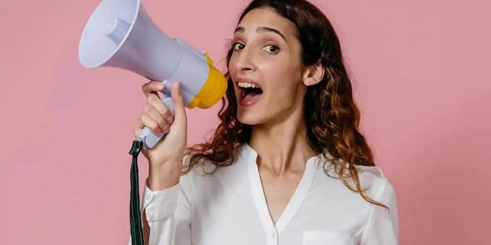 woman speaking into megaphone