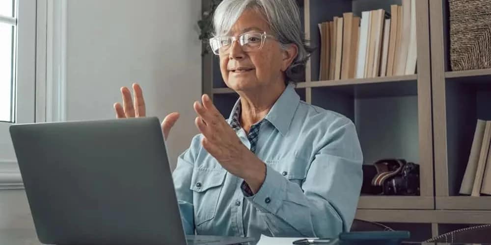 woman in front of laptop answering interview questions